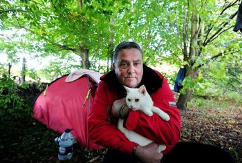 Brian Simmonds, 56 with Lilly the cat. See National copy NNTRAMP: An ungrateful beggar has turned his nose up at a kind woman who went out of her way to raise £1,300 to help find him a home - because he won't abandon his cat. Brian Simmonds, 56, sparked an outpouring of generosity after he was spotted living in a makeshift camp in woodland by the side of a main road with his feline friend Lily. Young mum Chloe-May Mouland launched a desperate bid to rehome the former electrician before Christmas - raising more than £1300 on an online crowdfunding site.