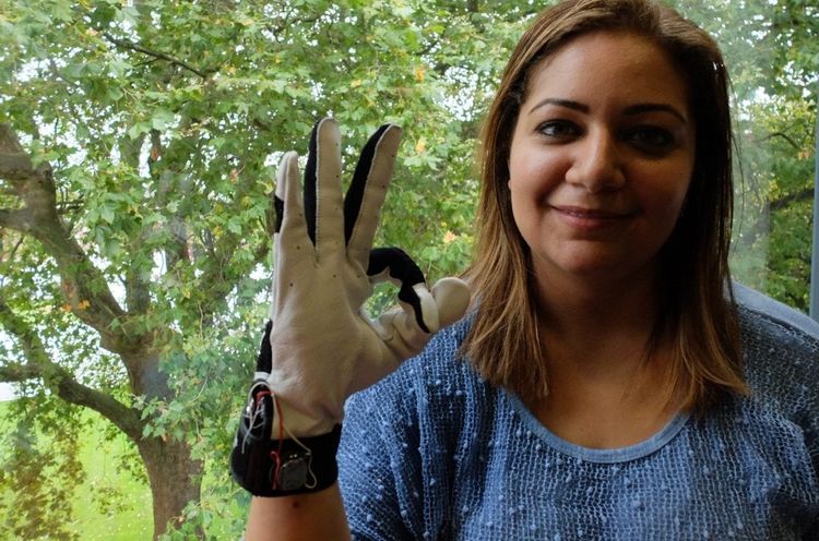 Hadeel Ayoub wearing the smart glove which translates sign language - into speech. See National copy NNGLOVE: A savvy student has designed a 'smart glove' which translates sign language - into speech. PhD student Hadeel Ayoub designed the BrightSign to help people with speech disabilities communicate without needing an interpreter. Hadeel, who specialises in digital and software design at Goldsmiths University, has been working on the BrightSign for the past two years as part of her PhD project. She said: "What it does is it translates sign language to text into speech in real time to allow people with speech disabilities to communicate with the general public without having to have an interpreter or someone to communicate on their behalf.