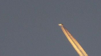 Tyron Osbourne, 52, from Exmouth, Devon, spotted a mystery object above the Devon town, from his garden.  See SWNS story SWUFO; Tyron Osborne, 52, of Brixington, was sitting at home on a day off work when he saw what appeared to be a shooting star. This prompted him to grab his camera and tripod and capture the moment that possibly saw an alien flyover. Dominoes Pizza worker Tyron admitted he was a UFO sceptic until the moment he saw what appears to be a flying saucer travelling towards Lympstone.  He said: “I noticed a star on the horizon and as soon as the sun went down the star started moving at a pace.