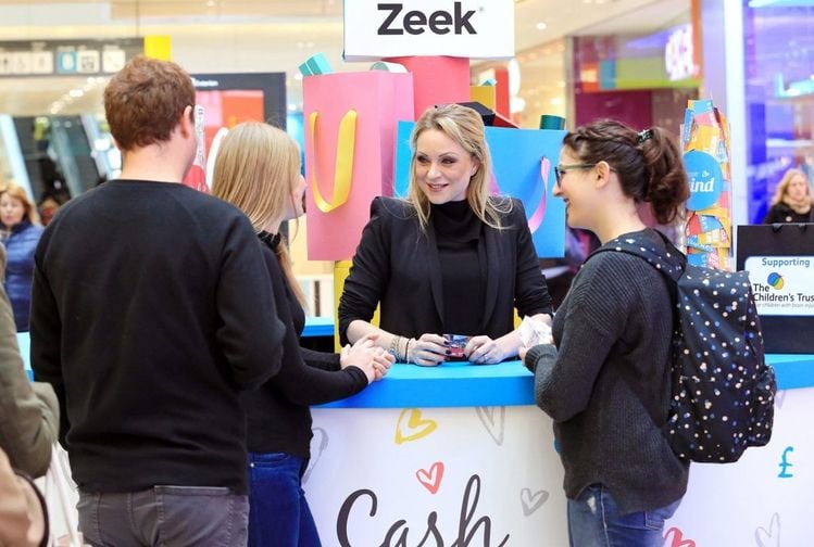 Rita Simmons, appeared at the Zeek Cash or Kind swap shop in Westfield, Stratford today helping shoppers swap unwanted gift cards for cash or donate the value to The Childrens Trust.

Eastenders’ Rita Simons swaps Albert Square for Westfield to launch swap-shop for unwanted gift cards.

•	Zeek’s ‘Cash or Kind’ store at Westfield Stratford allows members of the public to swap unwanted gift cards for cash to keep or donate the value to charity
•	47% of Brits admit they have received an unwanted gift card or voucher, with  £300million wasted every year 

Today, former Eastenders star Rita Simons swapped her market stall in Albert Square to launch a pop-up shop in Westfield, Stratford. The shop allows members of the public to exchange their unwanted gift cards for cash or donate the value to The Children’s Trust, a leading charity for children suffering from brain injury. 

The swap-shop, open for one day only, was set up by Europe’s biggest gift card marketplace, Zeek, in response to new research showing that 47% of Brits have at one time received an unwanted gift card or voucher, with an estimated £300million of unused credit in the UK every year.

The vast majority of unwanted items will be re-sold (23%) or re-gifted (33%), however one in seven (14%) will never see the light of day, gathering dust in drawers or even being relegated to the bin.

The gift card swap shop comes at the perfect time of year as, contrary to widespread belief, the most popular week for returning unwanted items is the second week of January, with 15% choosing to wait until the festivities have died down before hitting the high street. A sizeable 70% of us even went as far as to say they actively avoid the shops between Boxing Day and the New Year with half of us citing crowds as a reason to avoid the high street. 

Rita Simons, who exited the popular BBC soap in an explosive storyline over New Year, opened the shop, as eager shoppers got ready to exchange their unwanted gift