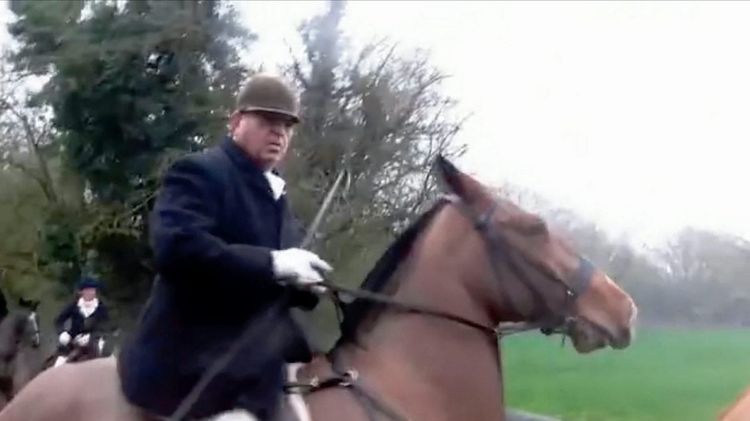 The moment a Huntsman allegedly whips female Sabateur. See SWNS story SWHUNT; Body-camera footage from the West Midlands Hunt Sabateurs reveals a clash with the Atherstone Hunt on a footpath. The protesters claim the horsemen were backing into the sabs before one rider shouts: "It's dangerous here. Come on, be fair." Then a loud thump is heard followed by a scream before the riding man is caught on camera with his riding crop up near the injured woman hunched over in pain. Sabs claim the woman was taken to hospital following the clash in Shackerstone, Leicestershire, on Saturday for a large gash in her head to be glued.