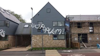 The latin graffiti on the houses in Chesterton, Cambridge. See Masons copy MNLATIN: An educated vandal has attacked a new £1.25m houses in one of Britain's top university cities - with graffiti in LATIN. The protestor made his mark in an apparent objection at the lack of affordable new for locals in Cambridge, one of the UK's property hotspots. He daubed 'locus in domos loci populum' - in large white letters on four newly-built detached homes - which roughly means 'Local homes for local people'.