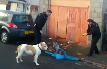 This is the shocking moment Judah Adunbi was tasered in the face by a police officer in Bristol. See SWNS story SWTASER; Bungling police officers tasered their own black Race Relations Advisor in the face - after mistaking him for a wanted man. A stunned passerby filmed the officers confronting 63-year-old Judah Adunbi - who works to smooth relations between police and the black community - and ask for his name. But when the indignant grandfather refuses and tries to enter his home officers shout “Taser” and shoot the electric gun at his face. Mr Adunbi, one of the founders of the Independent Advisory Group set up by the police with the BME community in Bristol, then falls to the ground.