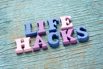 Life hacks phrase made of wooden colorful letters on vintage background