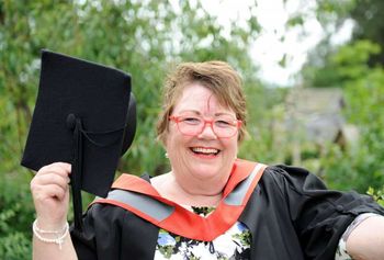 Taxi driver Ann Roberts.  Studying for a degree has quite literally been a journey for Ann Roberts as she hit the books while working as a taxi driver.  See NTI story NTITAXI.  The 61-year-old would pull night shifts on the road and then arrive at Staffordshire University for 9am lectures. And she even managed to do some of her studying in the cab.  Now all the hard work has paid off as Ann, from Hilderstone, has graduated with a 2:2 honours degree in modern history.