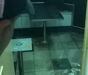 Shocking footage show what appears to be human waste on the floor of a west London Burger King branch after localised flooding covered the tiles in a thick brown sludge. See story SWBURGER. Two videos, taken by an outraged customer, show the filthy downstairs area of the Burger King branch in Gloucester Road just after 10pm on 8 August. But when the customer complained to a member of staff and pointed out the revolting conditions - he was told to leave the eatery. The customer, who has asked to remain anonymous, discovered the revolting room when he and two friends tried to find the toilets at the fast food joint. The footage shows the customer walking through the disgusting downstairs area pointing out what appears to be an open hole in the basement of the restaurant. The customer stares down the hole and announces it is "the sewer" to his friend who was filming the shocking conditions at the fast food joint.