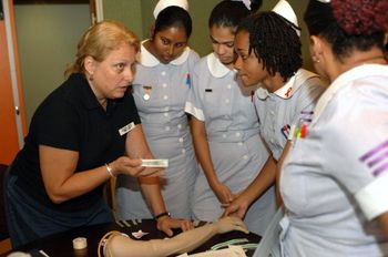 070918-N-7088A-100 
CHAMPS FLEURS, Trinidad and Tobago (Sept. 18, 2007) - Genie Lindsey, a registered nurse with Project Hope attached to Military Sealift Command hospital ship USNS Comfort (T-AH 20), explains the correct procedures for administering an intravenous tube to nursing students at the Eric Williams Medical Science Complex. Comfort is on a four-month humanitarian deployment to Latin America and the Caribbean providing medical treatment to patients in a dozen countries. U.S. Navy photo by Mass Communication Specialist 2nd Class Elizabeth R. Allen (RELEASED)