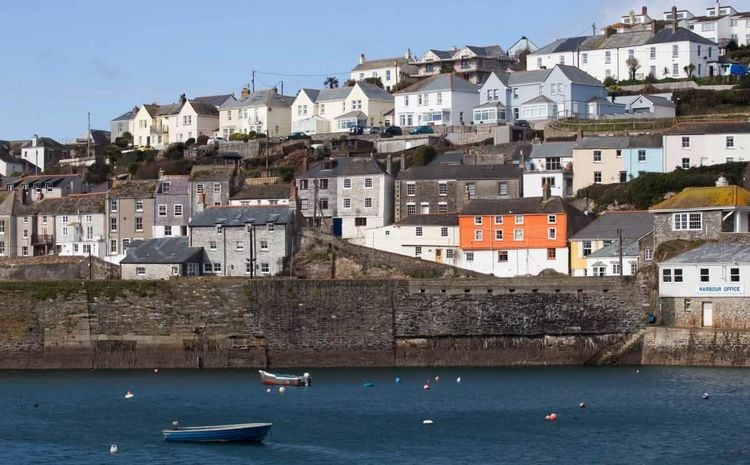 Locals who have been priced out of their pretty fishing village have voted to ban second-home owners from buying new builds in a landslide victory. Mevagissey, in Cornwall, has seen a boom in the number of houses being purchased as holiday homes over recent years.