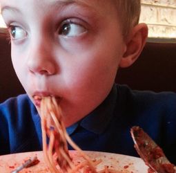 eating spaghetti food