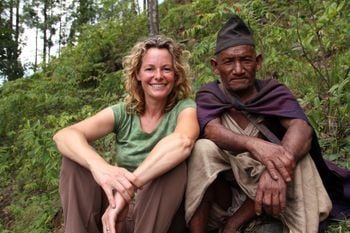 Programme Name: Kate Humble: Living with Nomads - TX: 05/06/2015 - Episode: Kate Humble: Living with Nomads - Nepal (No. 1) - Picture Shows: Presenter Kate Humble sat with Mein Bahadur (Raute elder), Nepal
  - (C) Indus Films - Photographer: Kate Owen