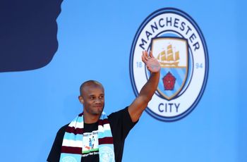 Manchester City's Vincent Kompany waves to fans during the trophy parade in Manchester.