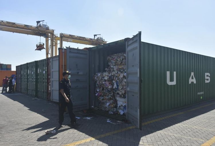 Indonesian custom officers open containers full of waste at the Tanjung Perak port in Surabaya, East Java, Indonesia, Tuesday, July 9, 2019. Indonesia is sending dozens of containers of imported waste back to Western nations after finding it was contaminated with used diapers, plastic and other materials, adding to a growing backlash in Southeast Asia against being a dumping ground for the developed world's rubbish.(AP Photo)