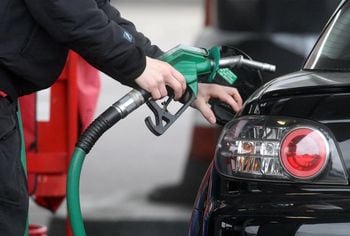 Embargoed to 0001 Wednesday April 03 File photo dated 22/02/13 of a person using a petrol pump. New figures show fuel prices have risen for the second consecutive month.