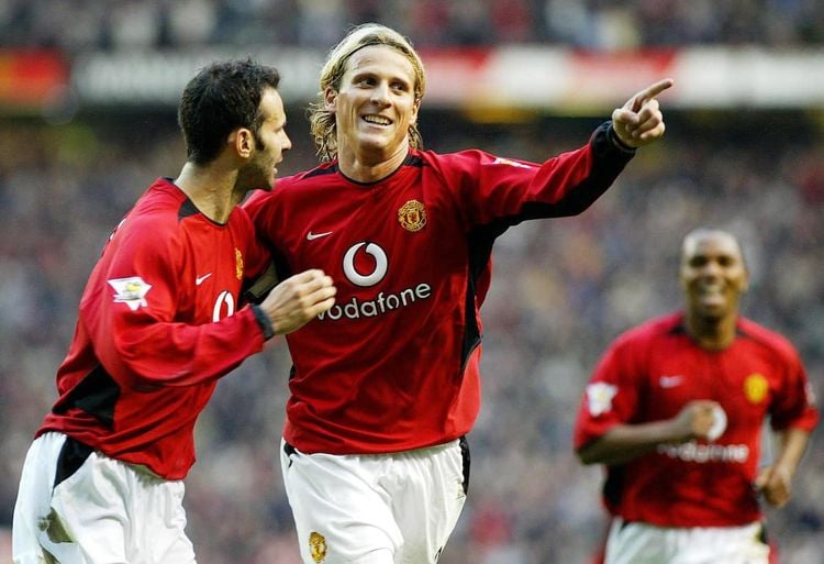 Manchester United's Diego Forlan celebrates with team-mate Ryan Giggs (left) after scoring against Portsmouth during the Barclaycard Premiership match at Old Trafford,   THIS PICTURE CAN ONLY BE USED WITHIN THE CONTEXT OF AN EDITORIAL FEATURE. NO WEBSITE/INTERNET USE UNLESS SITE IS REGISTERED WITH FOOTBALL ASSOCIATION PREMIER LEAGUE.