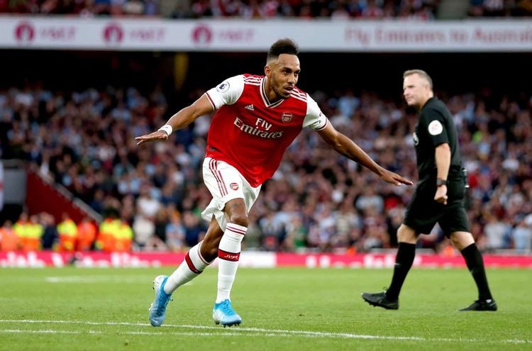 Arsenal's Pierre-Emerick Aubameyang celebrates scoring his side's third goal of the game during the Premier League match at the Emirates Stadium, London.