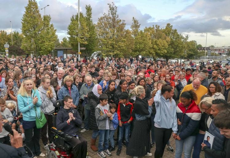 Hundreds of people pay their respects at a vigil outside Hillingdon station in London. Credit;PA