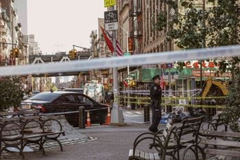 New York Police Department officers investigate the scene of an attack in Manhattan's Chinatown neighborhood, Saturday, Oct. 5, 2019 in New York. Four men who are believed to be homeless were brutally attacked and killed early Saturday in a street rampage. NYPD Detective Annette Shelton said that a fifth man remained in critical condition after also being struck with a long metal object that authorities recovered. (AP Photo/Jeenah Moon)