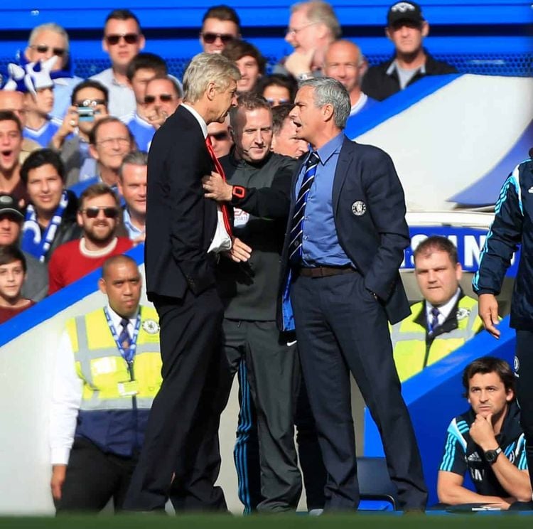 Chelsea manager Jose Mourinho (right) has a heated exchange with Arsenal manager Arsene Wenger (left) on the touchline during the Barclays Premier League match at Stamford Bridge, London. Credit;PA