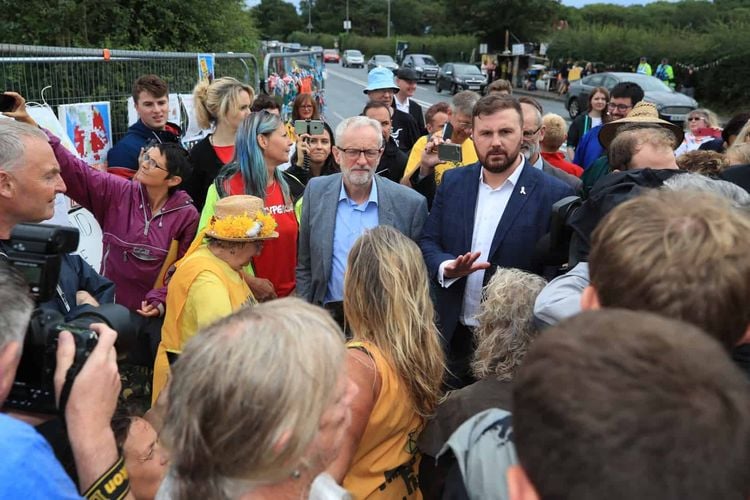 Jeremy Corbyn speaks to anti-fracking protesters outside the gate at the Preston New Road shale gas exploration site in Lancashire (Peter Byrne/PA)