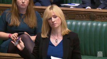 Labour MP for Canterbury, Rosie Duffield, holds up a medal from one of her constituents in the House of Commons in London. Credit;PA