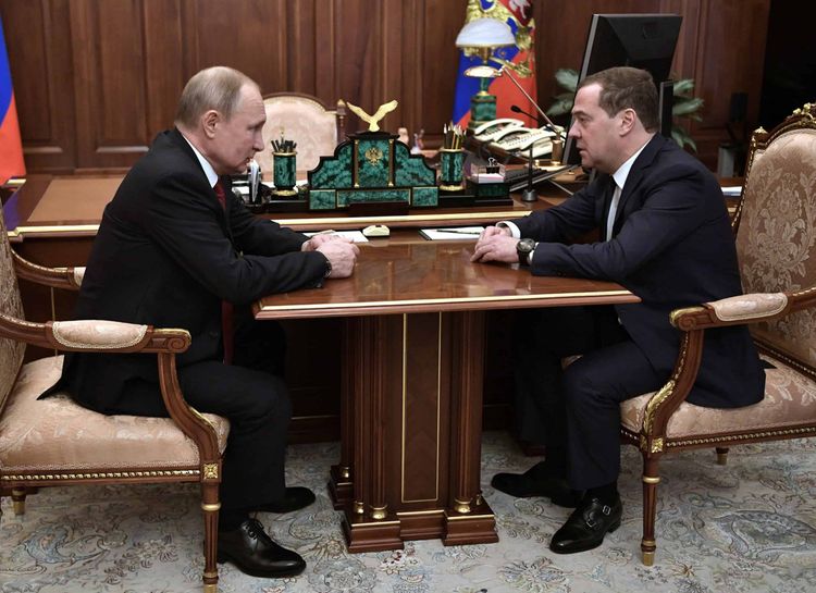 Russian President Vladimir Putin, left, listens to Russian Prime Minister Dmitry Medvedev during their meeting in the Kremlin in Moscow, Russia, Wednesday, Jan. 15, 2020. (Alexei Nikolsky, Sputnik, Kremlin Pool Photo via AP)