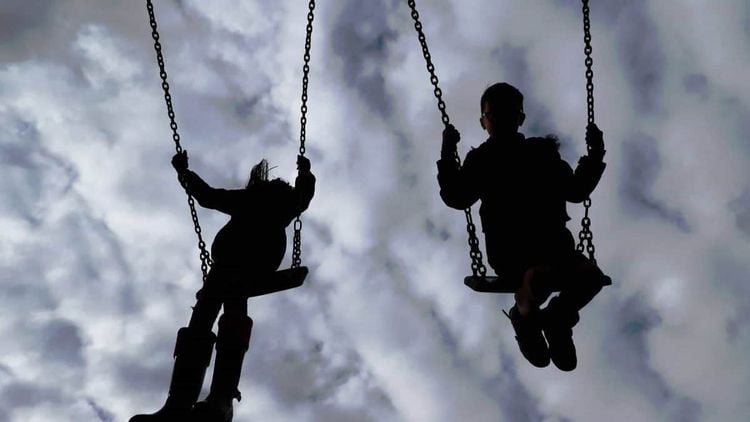 children on swings