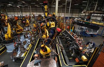 Workers on the production line at Nissan's factory in Sunderland after they were told that the car manufacturer is to end the night shift at its UK plant.