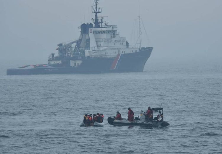 Handout dated 10/05/20 issued by PSP Cormoran / Marine nationale showing 10 migrants who were found on a boat off Boulogne-sur-Mer by French authorities.