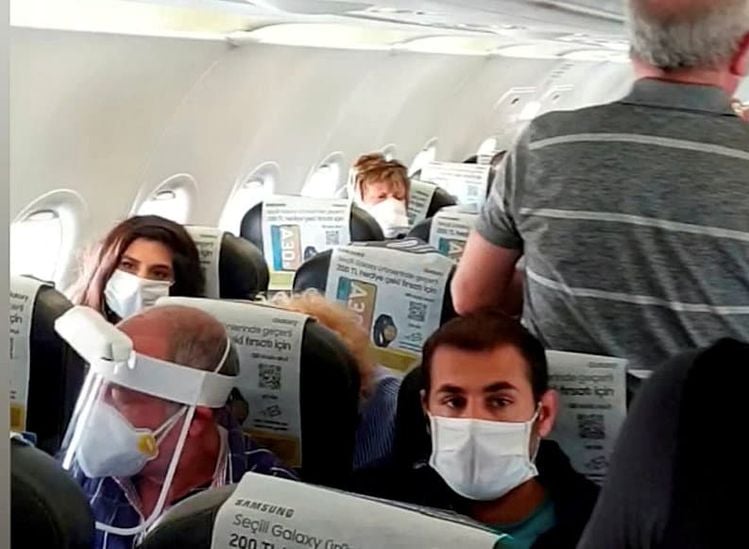 Video grab from a  ''crowded'' repatriation flight from Turkey to the UK on April 28 Credit;SWNS