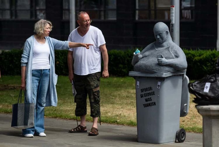 A mystery statue sporting a string vest and beer belly now looks over the site where Colston’s statue was famously toppled from its plinth in Bristol. Bristol. 15 June 2020.Credit;SWNS