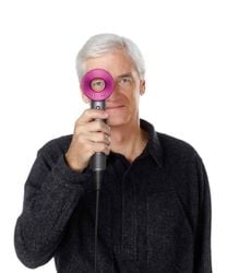 Undated Dyson handout image of Sir James Dyson with his company's new Supersonic hair dryer, which features its trademark bladeless fan.