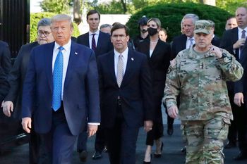 FILE - In this June 1, 2020 file photo, President Donald Trump departs the White House to visit outside St. John's Church, in Washington. Part of the church was set on fire during protests on Sunday night. Walking behind Trump from left are, Attorney General William Barr, Secretary of Defense Mark Esper and Gen. Mark Milley, chairman of the Joint Chiefs of Staff. Milley says his presence “created a perception of the military involved in domestic politics.” He called it “a mistake” that he has learned from. (AP Photo/Patrick Semansky)