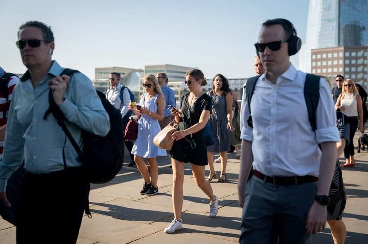 Commuters cross London Bridge, London, Credit;SWNS