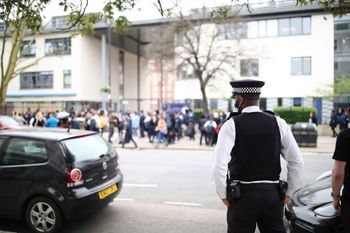 A police officer outside Pimlico Academy School, west London. Credit;PA