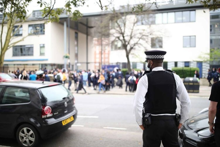 A police officer outside Pimlico Academy School, west London. Credit;PA