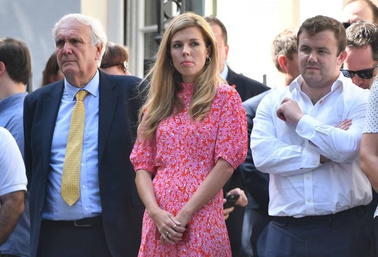 Eddie Lister (L) alongside Carrie Symonds.