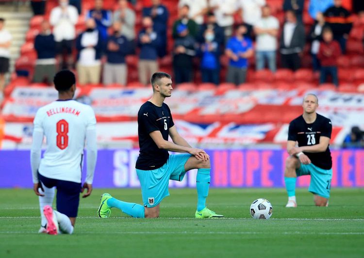 Austria's Sasa Kalajdzic takes the knee ahead of the International Friendly at The Riverside Stadium, Middlesbrough. Picture date: Wednesday June 2, 2021.