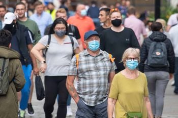 People wearing face masks among crowds of pedestrians in Covent Garden, London. Rumours were abound in the Sunday newspapers that Prime Minister Boris Johnson, who is due to update the nation this week on plans for unlocking, is due to scrap social distancing and mask-wearing requirements on so-called "Freedom Day". Picture date: Sunday July 4, 2021.