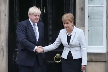 RETRANSMITTED CORRECTING BYLINE Scotland's First Minister Nicola Sturgeon welcomes Prime Minister Boris Johnson outside Bute House in Edinburgh ahead of their meeting.