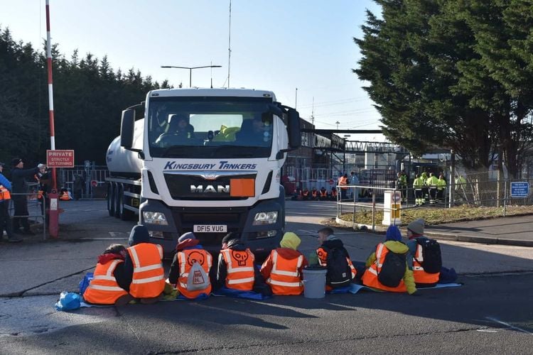 Activists from Just Stop Oil during one of their blockades at the Esso depot in Wood Lane, Birmingham early on Friday. Credit:PA