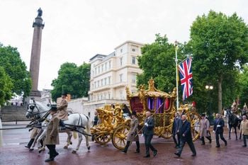 The gold state coach on The Mall during an early morning rehearsal. Credit;PA