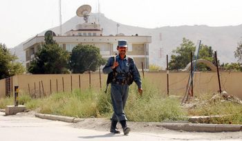 A guard walks in front of the British Embassy in Kabul, Afghanistan. Credit;PA