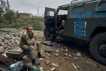 A Ukrainian soldier takes a break to rest. Credit:PA