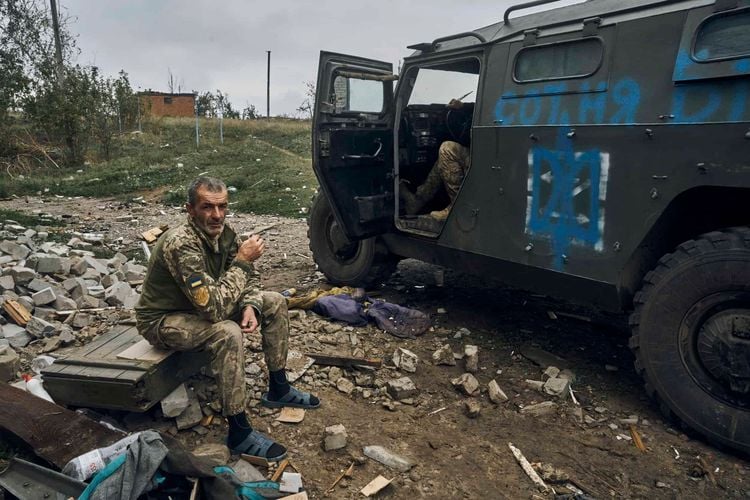 A Ukrainian soldier takes a break to rest. Credit:PA