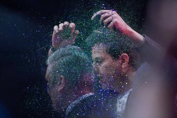 A protester throws glitter over and disrupts Labour leader Sir Keir Starmer making his keynote speech during the Labour Party Conference in Liverpool. Picture date: Tuesday October 10, 2023.