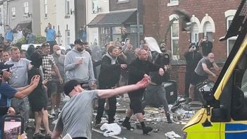 Trouble flares during a protest in Southport, after three children died and eight were injured in a "ferocious" knife attack during a Taylor Swift event at a dance school on Monday. A 17-year-old male from Banks, Lancashire, has been arrested on suspicion of murder and attempted murder over the incident. Picture date: Wednesday July 31, 2024.