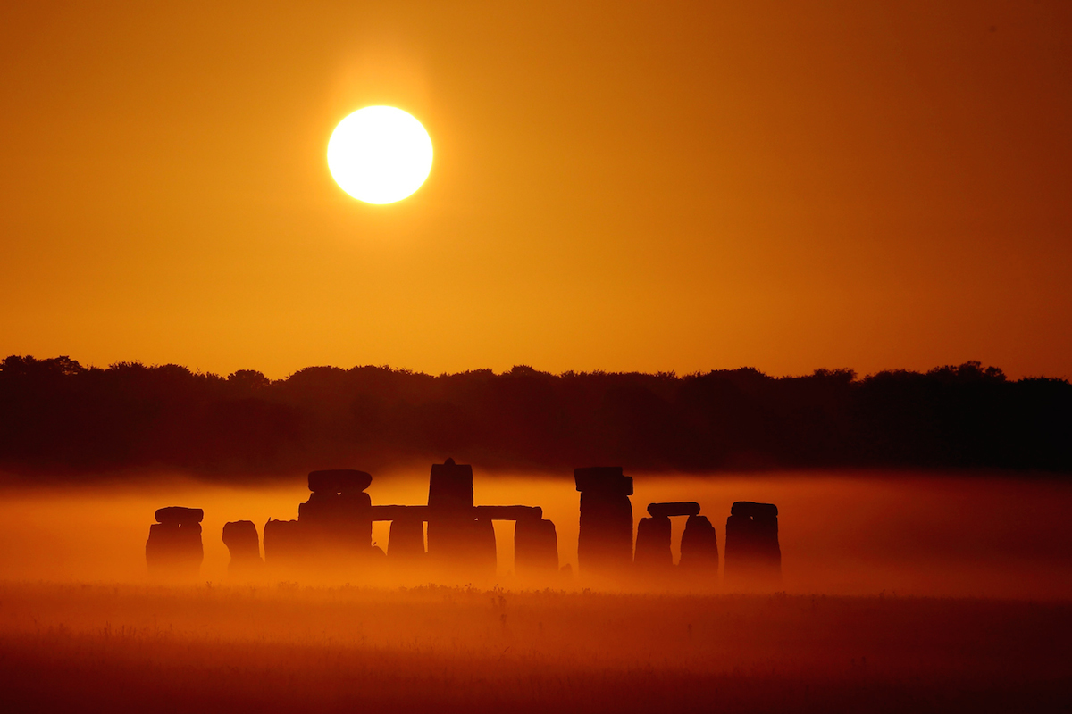 SWNS Pictures of the Year 2015 - One hundred of the most compelling images on the SWNS wire this year as chosen by our picture editors. The sun rises over Salisbury Plain as it's light illuminates the mist shrouding Stonehenge, Wiltshire, July 7 2015. Amateur photographer Robin Morrison made half a dozen visits to the ancient megalith, travelling over a hundred miles each time, to capture the precise lighting conditions he wanted. The normal weather patterns in the UK mean that a clear sky just a few minutes after sunrise is uncommon - a clear sky at sunrise combined with a misty morning is an extremely rare occurrence.