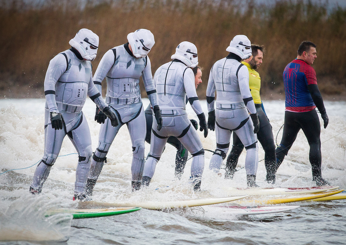 SWNS Pictures of the Year 2015 - One hundred of the most compelling images on the SWNS wire this year as chosen by our picture editors. Surfers dressed as Star Wars Stormtroopers ride the Severn Bore in Gloucestershire. 27 November 2015. See SWNS story SWTROOPER: There was an unworldly sight in the Forest of Dean this morning (Friday 27th November) when a trio of Star Wars Stormtroopers surfed the spectacular Severn Bore. Key scenes from the upcoming Star Wars episode VII were filmed in nearby Puzzlewood and can be seen several times in the trailer. Swapping the Death Star for surfboards, the elite soldiers of the Galactic Empire took to the waves to mark the release of the highly anticipated new Star Wars film and a new TV & Movie Trail. The Forest of Dean’s atmospheric and picturesque location provided a natural stage for the film, which director J.J Abrams referenced in a thank you letter to all of the movie's cast and crew.