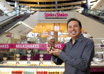 Owner Mark Glassman poses with a "Cookie Overload" milkshake at Sticks & Shakes in the Fashion Show Mall Tuesday, Jan. 13, 2015. The kiosk sells frozen gelato and sorbet on a stick as well as customized milkshakes. The company also has a location at the Galleria Mall in Henderson.