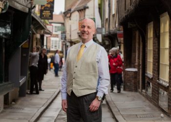 David Leckie, 58, of York, on York's iconic Shambles street. Mr. Leckie, a therapist and mediator, has launched the Divorce Hotel service, where couples can come to a harmonious settlement over the course of a weekend. April 17, 2017.